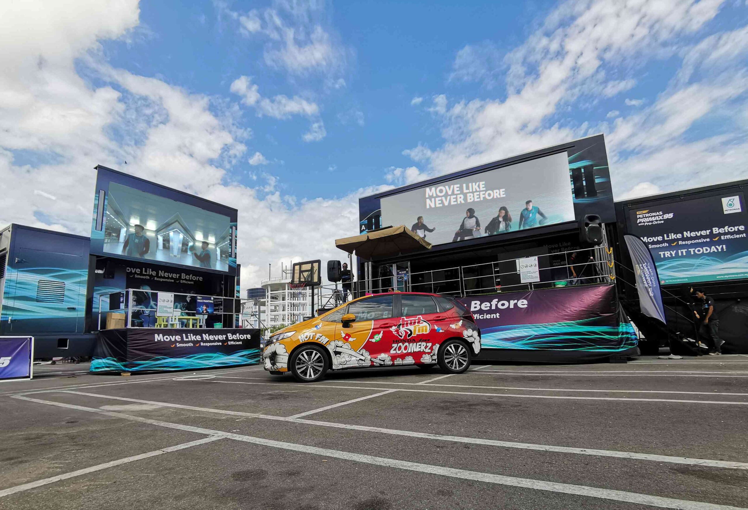 Dynamic LED screen at the roadshow, captivating attendees with colorful graphics.