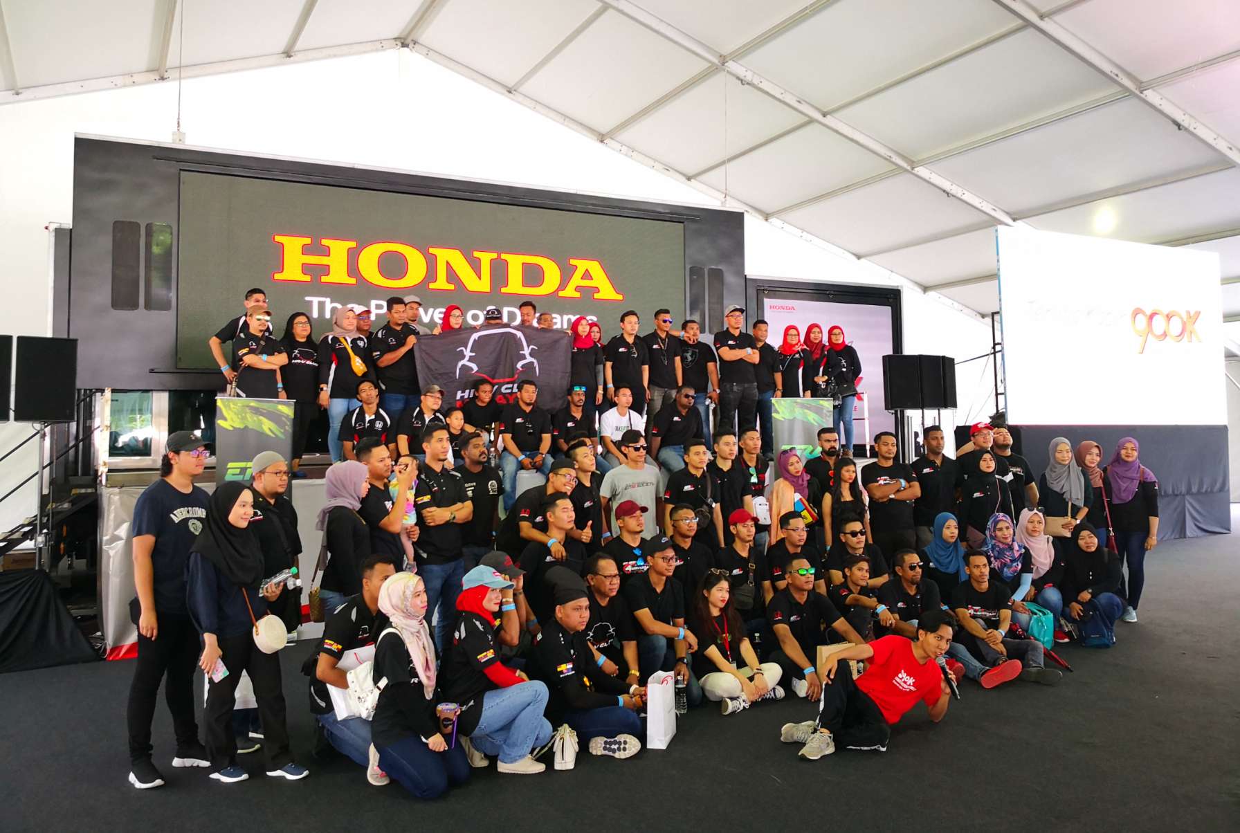 Honda Community in front of the transformable 40ft LED container truck