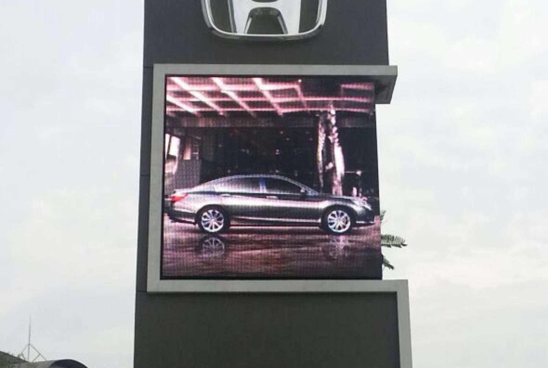 Outdoor P10 LED screen displaying promotional videos