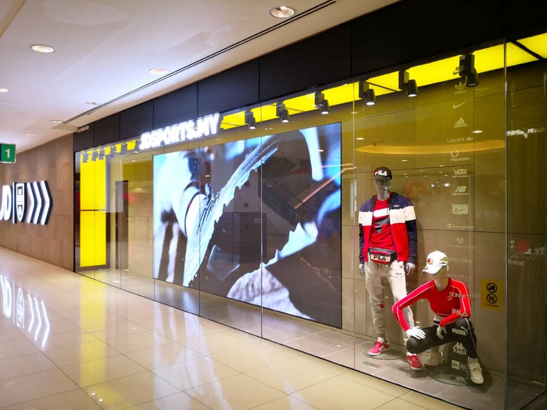 Wide-angle view of JD Sports Penang highlighting LED feature wall
