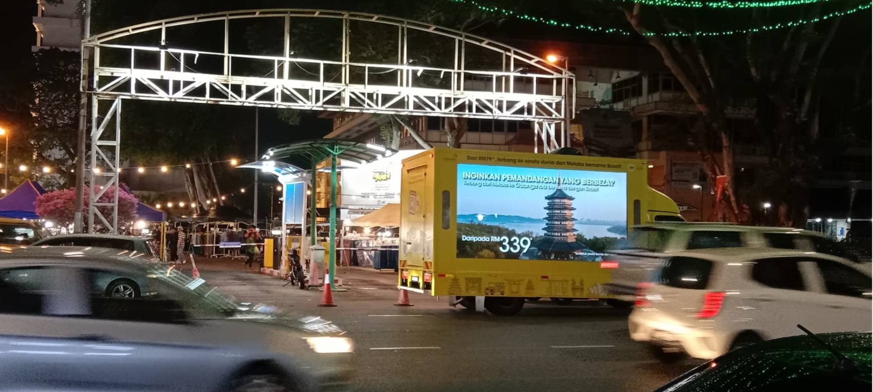 Scoot Airlines digital advertising truck with large LED screens captivating the road