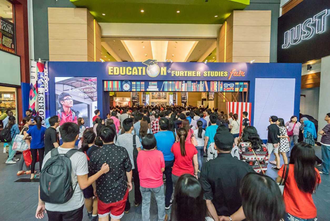 Dynamic LED screen featuring interactive content on various universities and courses available.