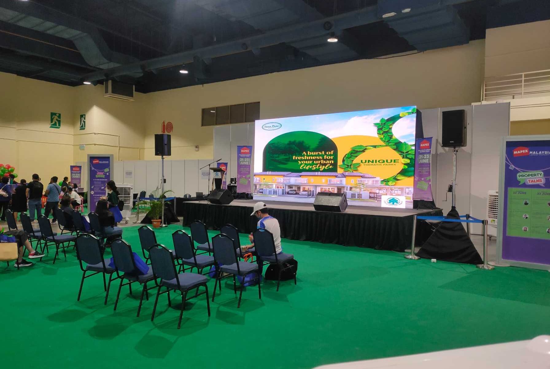 Prominent LED screen showcasing property listings